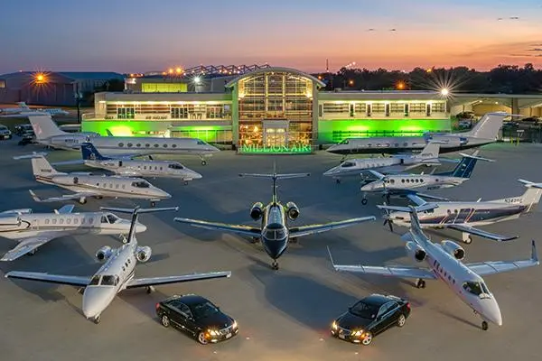 Luxury Dallas Love Field Chauffeur Service with executive black car transfer at private aviation terminal